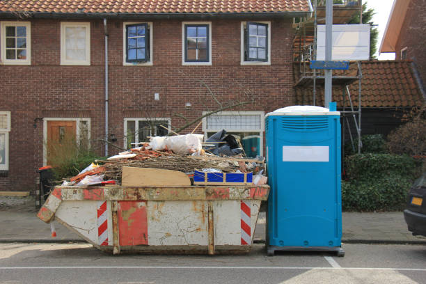 loaded dumpster near a construction site, a home renovation or maintenance